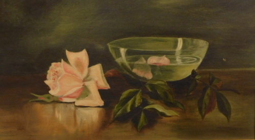 Edwardian School. Still life, bowl and rose head on a table, oil on canvas, unsigned, 25cm x 44cm.