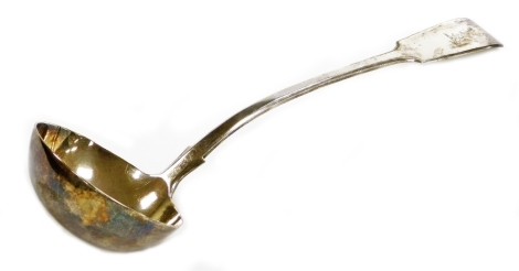 A Victorian silver fiddle pattern serving ladle, with arched handle and bearing crest for the Fillingham Family formerly of Syerston Hall near Newark, London 1874, 34cm long, 9½oz.