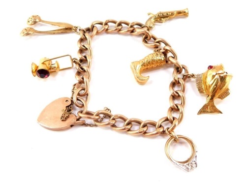 A 9ct rose gold curb link charm bracelet, with six charms as fitted, on a heart shaped padlock clasp, with safety chain, 27.8g.