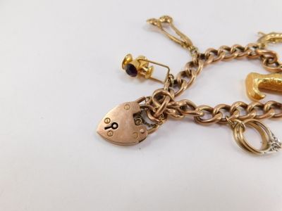 A 9ct rose gold curb link charm bracelet, with six charms as fitted, on a heart shaped padlock clasp, with safety chain, 27.8g. - 3