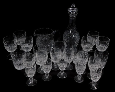 A Waterford part suite of table glass decorated in the Colleen pattern, comprising decanter and stopper, water jug, six red wine glasses, six white wine glasses, five water glasses and five port glasses.