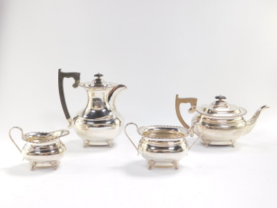 An Elizabeth II silver four piece tea and coffee set, London shape, with a gadrooned rim, and raised on four paw feet, comprising tea pot, coffee pot, cream jug and sugar bowl, Viners Ltd, Sheffield 1957, 64.12oz. - 2