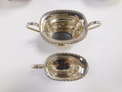 An Elizabeth II silver four piece tea and coffee set, London shape, with a gadrooned rim, and raised on four paw feet, comprising tea pot, coffee pot, cream jug and sugar bowl, Viners Ltd, Sheffield 1957, 64.12oz. - 4