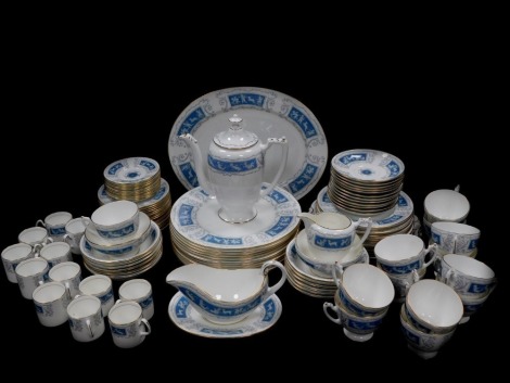 A Coalport porcelain dinner tea and coffee service decorated in the Revelry pattern, comprising oval meat platter, sauce boat on stand, twelve dinner and eleven dessert plates, twelve fruit bowls, coffee pot, cream jug, two sugar bowls, a pair of bread pl