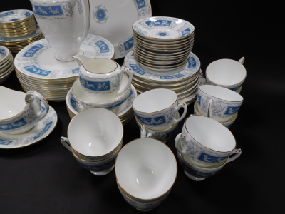 A Coalport porcelain dinner tea and coffee service decorated in the Revelry pattern, comprising oval meat platter, sauce boat on stand, twelve dinner and eleven dessert plates, twelve fruit bowls, coffee pot, cream jug, two sugar bowls, a pair of bread pl - 2