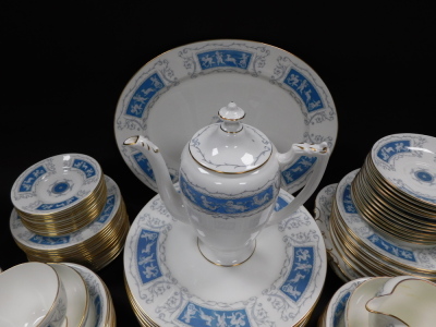 A Coalport porcelain dinner tea and coffee service decorated in the Revelry pattern, comprising oval meat platter, sauce boat on stand, twelve dinner and eleven dessert plates, twelve fruit bowls, coffee pot, cream jug, two sugar bowls, a pair of bread pl - 4