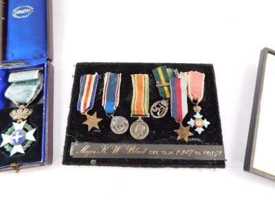 A group of miniature medals, named to Major K W Bland, CBE., TD., JP., Lived 1.2.07 to 11.08.78., comprising France and Germany Star, 1939-1945 Star, and Defence Medal, CBE, Territorial George V Efficiency Medal, and a George VI Coronation Medal, framed a - 2