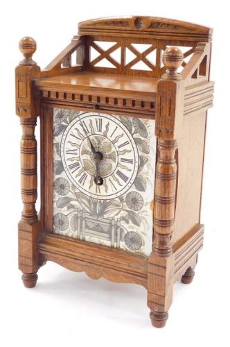 A French Aesthetic late 19thC oak cased mantel clock, rectangular ceramic dial painted with an urn of flowers, dial bearing Roman numerals, movement by J Marti & Cie, No 7017, with pendulum and key, 28cm high, 17cm wide, 11cm deep.