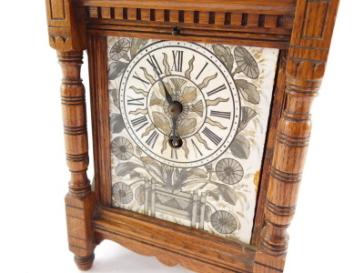 A French Aesthetic late 19thC oak cased mantel clock, rectangular ceramic dial painted with an urn of flowers, dial bearing Roman numerals, movement by J Marti & Cie, No 7017, with pendulum and key, 28cm high, 17cm wide, 11cm deep. - 2
