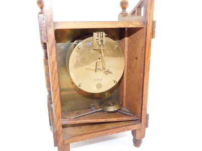 A French Aesthetic late 19thC oak cased mantel clock, rectangular ceramic dial painted with an urn of flowers, dial bearing Roman numerals, movement by J Marti & Cie, No 7017, with pendulum and key, 28cm high, 17cm wide, 11cm deep. - 3