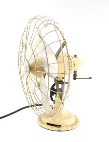 A Limit early 20thC electric fan, raised on a cream painted cast iron stand, Patent No 662079, etc., 36cm high.