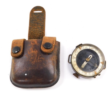 A Russian Adrianov Soviet Army Military orienteering compass, with a leather carrying wallet.