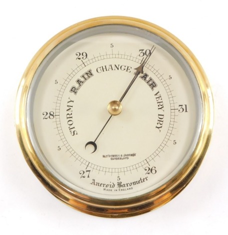 An early 20thC brass ship's aneroid barometer, by Hutchinson & Jackson of Sunderland, 18.5cm diameter.