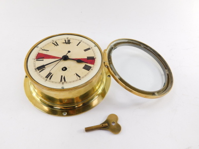 An early 20thC brass ship's clock, enamel dial bearing Roman numerals, with key, 20.5cm diameter. - 3