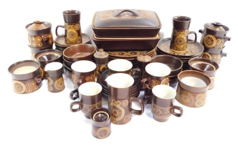 A Denby pottery dinner tea and coffee service decorated in the Arabesque pattern, including a pair of vegetable tureens and covers, dinner, dessert and side plates, twin handled soup bowls and covers, salt and pepper, coffee mugs and mugs. (a quantity)