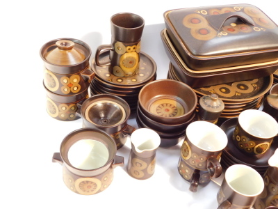 A Denby pottery dinner tea and coffee service decorated in the Arabesque pattern, including a pair of vegetable tureens and covers, dinner, dessert and side plates, twin handled soup bowls and covers, salt and pepper, coffee mugs and mugs. (a quantity) - 4