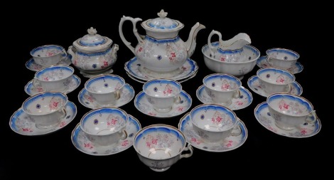 A Staffordshire early 19thC pottery tea service, painted with flowers, pattern no 17., comprising teapot, sucrier, slop bowl, cream jug, a pair of bread plates, and twelve tea cups and saucers.