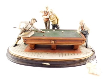 A Giuseppe Armani Capo di Monte porcelain figure group, Billiard Playing, designed by B Merli, raised on an oval wooden base, with certificates, 50cm wide.