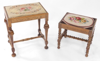 An early 20thC oak stool, with floral wool work seat, raised on turned legs, united by a bobbin turned H frame stretcher, together with a further oak stool, with wool work floral seat, raised on turned legs, united by an H frame stretcher. (2)