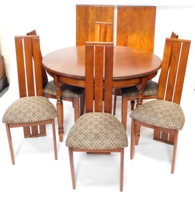 An oak dining room suite, comprising extending dining table, with moulded edge and turned legs, two loose leaves, 78cm high, 120cm wide, 222cm extended, and six chairs, each having rail back and padded seat. The upholstery in this lot does not comply with