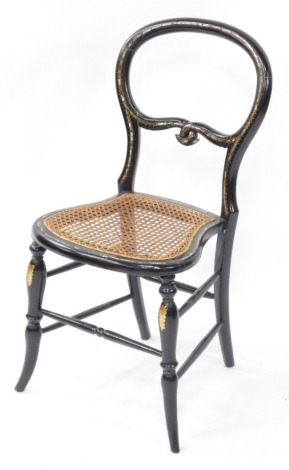 A Victorian mother of pearl inlaid papier mache balloon back bedroom chair, with a cane seat, raised on turned legs, united by stretchers.