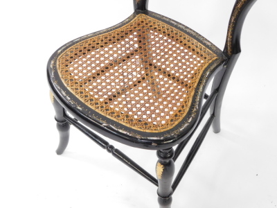 A Victorian mother of pearl inlaid papier mache balloon back bedroom chair, with a cane seat, raised on turned legs, united by stretchers. - 3