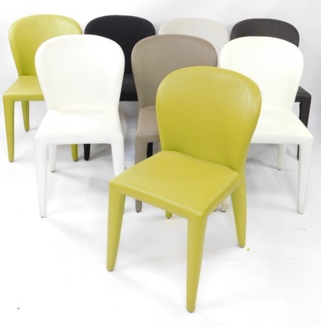 A harlequin set of eight of leather and felt upholstered dining chairs, three in cream, one pale brown, one dark brown, two green, and the felt chair in black.