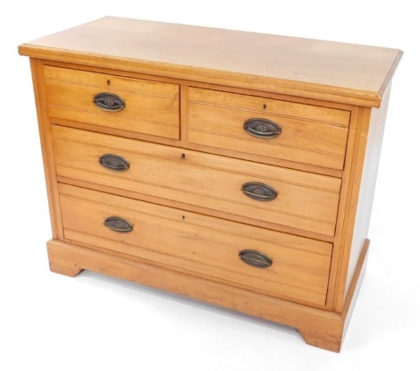 A walnut chest of drawers, the top with a moulded edge, two short and two long drawers, each with oval cast metal handles, on bracket feet, 82cm high, 105cm wide.