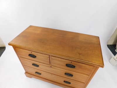 A walnut chest of drawers, the top with a moulded edge, two short and two long drawers, each with oval cast metal handles, on bracket feet, 82cm high, 105cm wide. - 2