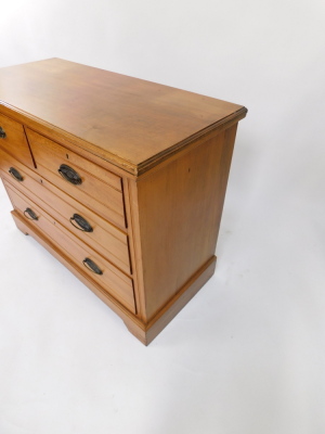A walnut chest of drawers, the top with a moulded edge, two short and two long drawers, each with oval cast metal handles, on bracket feet, 82cm high, 105cm wide. - 3