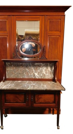 A late Victorian wardrobe, with moulded edge above a central mirror door, flanked by paneled sides, above a drawer, 146cm wide, together with an associated washstand, with a raised marble inset back, headed by oval bevelled mirror with carved supports, th