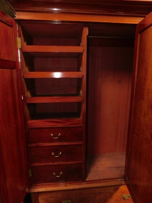 A late Victorian wardrobe, with moulded edge above a central mirror door, flanked by paneled sides, above a drawer, 146cm wide, together with an associated washstand, with a raised marble inset back, headed by oval bevelled mirror with carved supports, th - 3