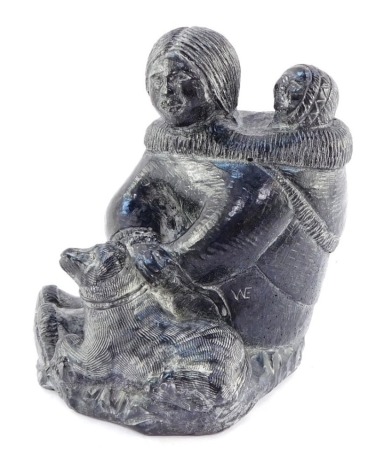 A Wolf Inuit sculpture of a seated mother and child, bears label, 14cm high.