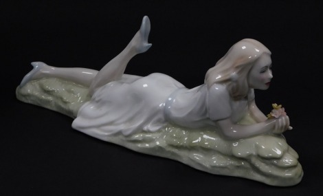 A Royal Doulton Reflections figure modeled as Idle Hours HN3115.