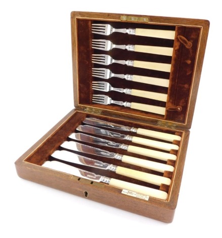 A George V silver and ivory handled half fish canteen of cutlery, cased, Walker & Hall, Sheffield 1932, 17.90oz, all in.