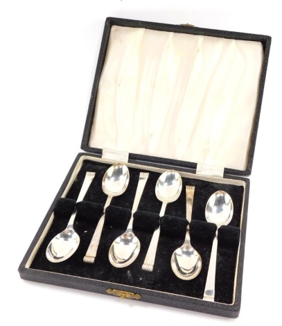 A set of six silver coffee spoons, with scroll end terminals, cased, Sheffield 1959, 2.42oz.