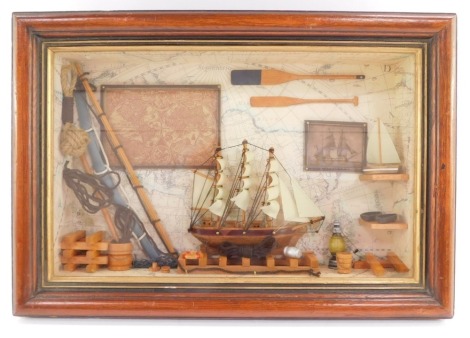 A Maritime diorama, with a three masted sailing vessel, further vessels, boats, oars, rigging, etc., glass cased, 31cm high, 45cm wide.