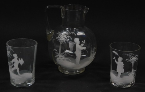 A Mary Gregory type late 19thC fluted glass, decorated with a boy with insect and net, 15.5cm high, together with a pair of tumblers. (3)