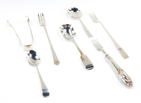 A group of assorted silver flatware, a Victorian silver scoop, a silver handled pickle fork, a pair of silver sugar knips, two pickle forks and a silver teaspoon, 5¼oz. (a quantity)