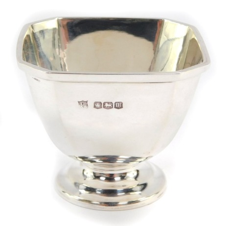 A George V silver condiment bowl, with a square set top with canted corners, maker TB & S, Sheffield 1929, 5cm high, 3oz.