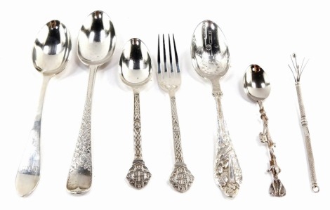 A group of silver and plated flatware, comprising a silver Fiddle pattern spoon with hammered floral detailing, London 1917, a pickle fork and spoon set, Sheffield 1959, a teaspoon bearing the initials JGB, Birmingham 1926, a prong, a EPNS decorative anim