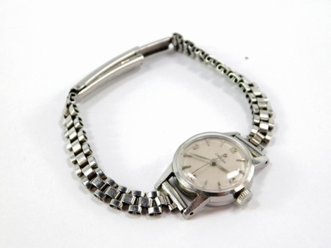 An Omega lady's stainless steel cased wristwatch, with small silvered coloured watch head, on a three strand expanding bracelet, the watch head 2cm wide. (boxed)