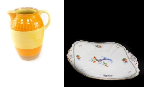 A Shelley pottery two tone jug, with orange and yellow finish, 17cm high, together with a Versaille pattern porcelain cake plate. (2)