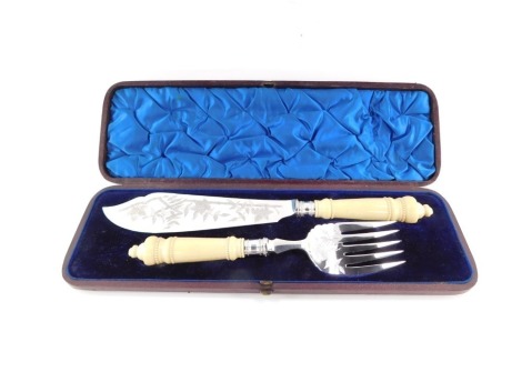 A Victorian pair of silver plated and ivory handled fish servers, each with an embossed leaf design, in a fitted case.