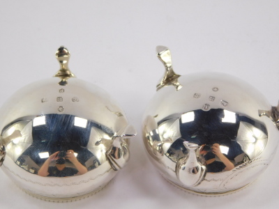 A pair of Victorian miniature circular silver salts, with a reeded collar and hammered detailing with vacant cartouche, on tripod feet, Sheffield 1876, 3.5cm high, 2½oz. - 3