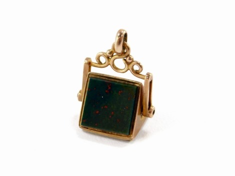 A 9ct gold swivel agate fob, of triangular prismatic design, set with green and red bloodstone and an orange agate, in rose gold, 6.8g all, 2.5cm high.