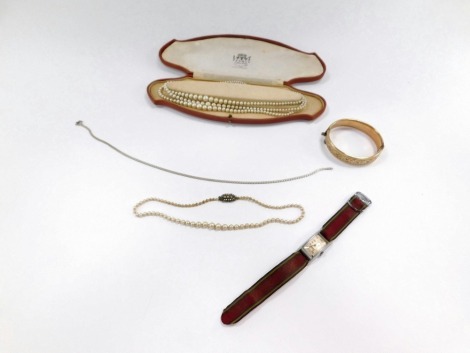 A group of costume jewellery, to include two faux pearl necklaces, a 9ct gold core metal bangle, silver necklace and a Lanco wristwatch. (a quantity)