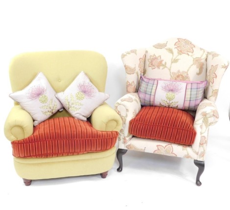 A floral upholstered wing back broad seated armchair on cabriole legs, and another button back example, both with matching striped seat.