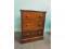 A mahogany chest of three drawers on a plinth base