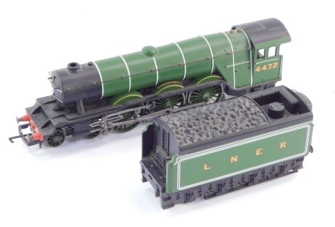 A Hornby dublo guage Flying Scotsman model locomotive and tender.